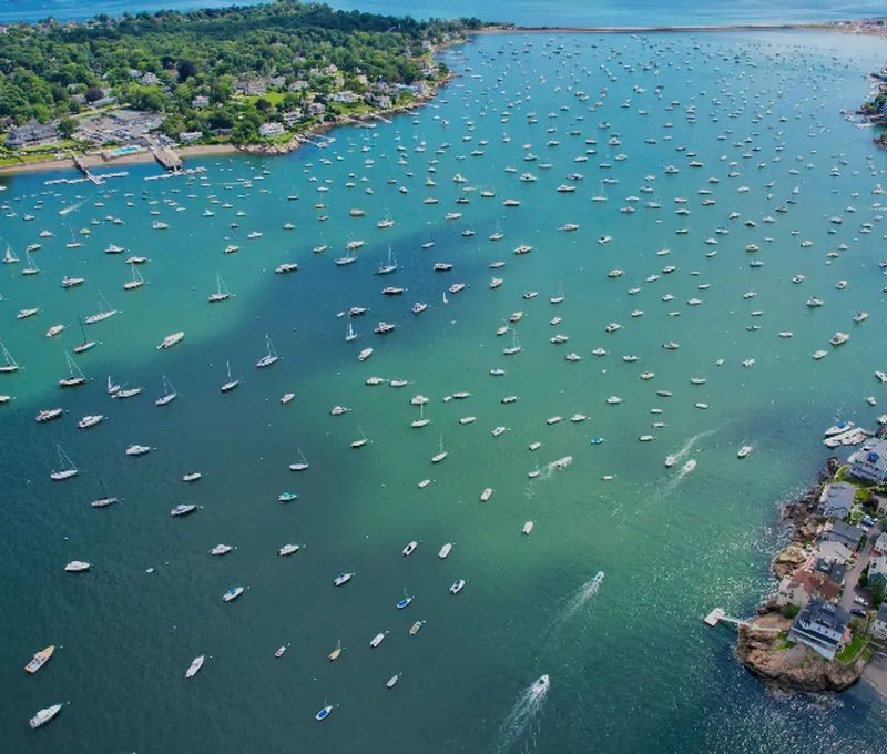 Colourful sailing boats on open sea under a clear sky